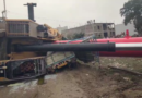 Crane falls from under-construction railway bridge