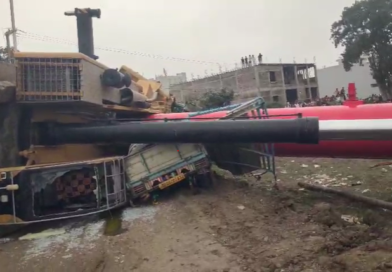 Crane falls from under-construction railway bridge